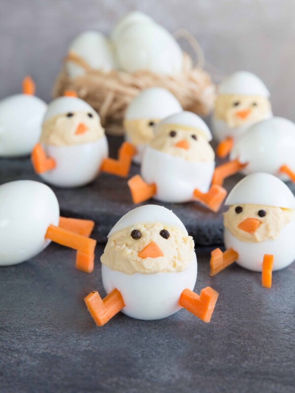 Deviled Egg Chicks with Hard Boiled Eggs in the background in a nest.