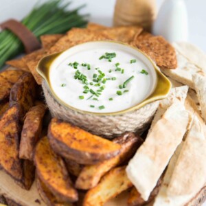 small bowl of dip served with Potato Wedges, Pita Bread and Tortilla Chips