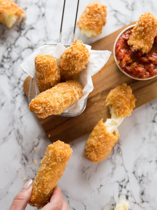 Crispy Halloumi Fries with marinara dipping sauce and cheese pull