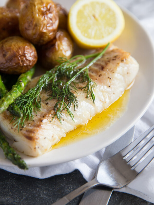 Pan Fried Cod with brown butter sauce, new potatoes, lemon and asparagus