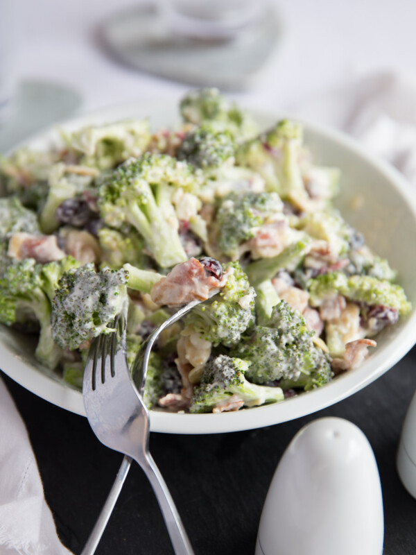 Crunch Broccoli Salad with Bacon served in a bowl with two forks