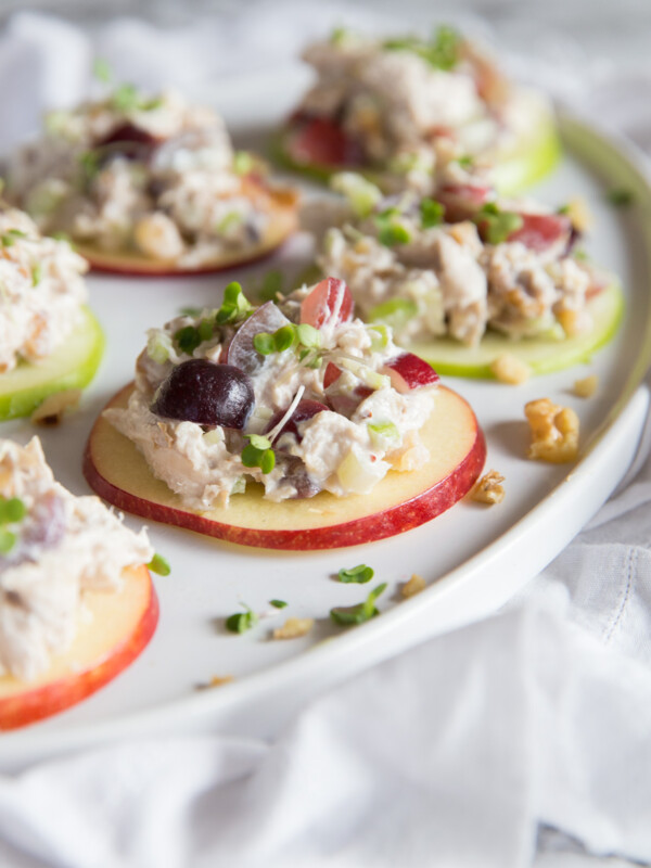 salad bites placed on long white tray garnish with cress