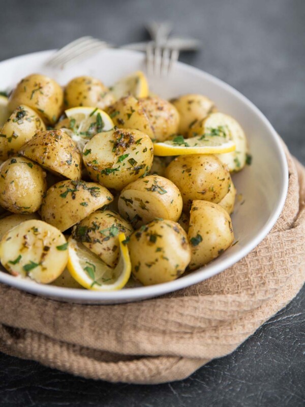 Boiled baby potatoes with lemon and browned butter served with chives and parsley