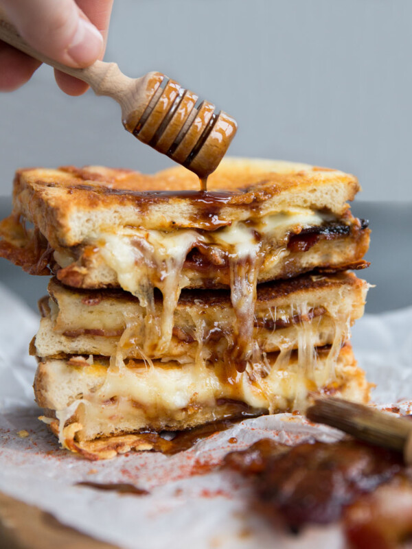 Grilled Cheese with honey dipper pouring over sauce