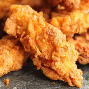 closeup of chicken tender with a few more in the background