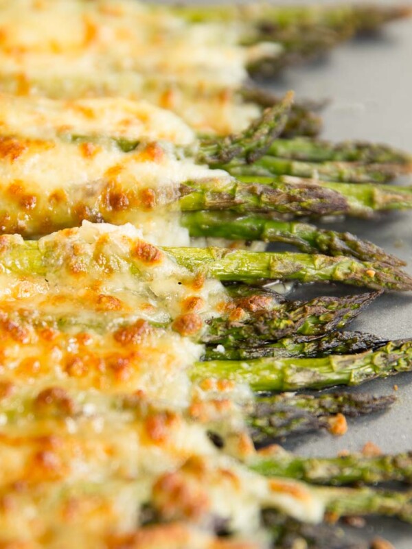 cheesy asparagus fresh out the oven on silver baking tray