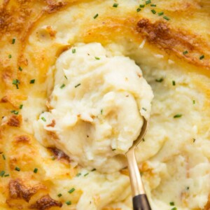 overhead shot of spoon scooping into mashed potato