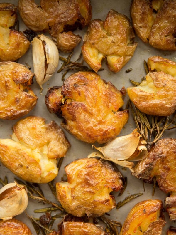 overhead of smashed potatoes on baking tray fresh out the oven