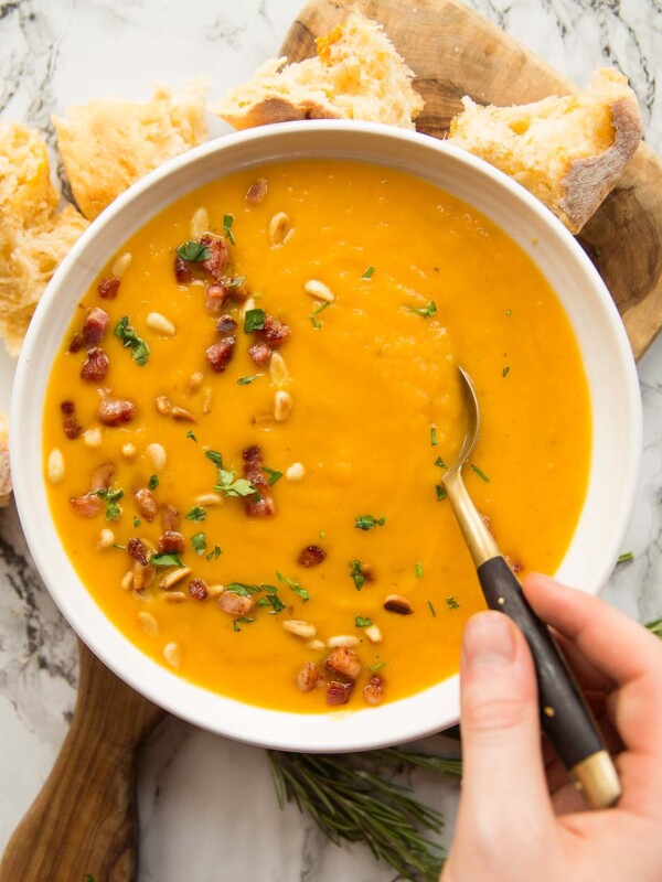 overhead shot of soup in a bowl with spoon digging in