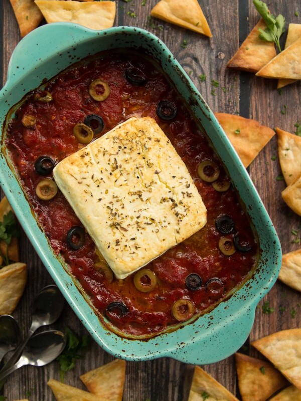 overhead shot of baked feta fresh out the oven surrounded by pita chips