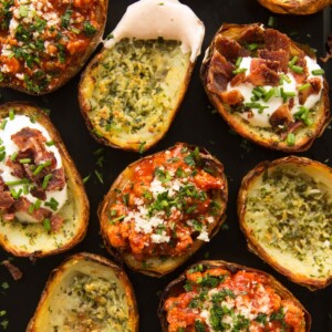 overhead shot of potato skins with fillings on oven tray