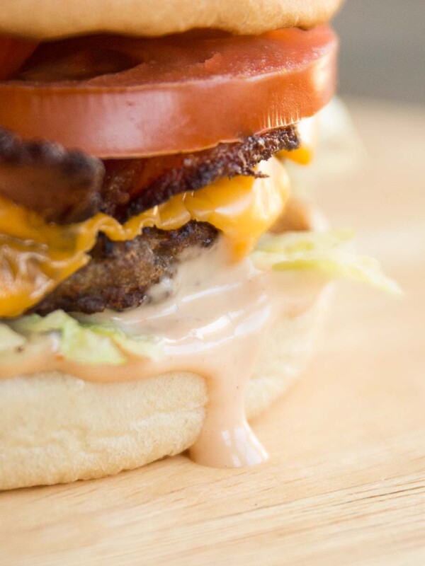 close up of burger sauce dripping down burger bun