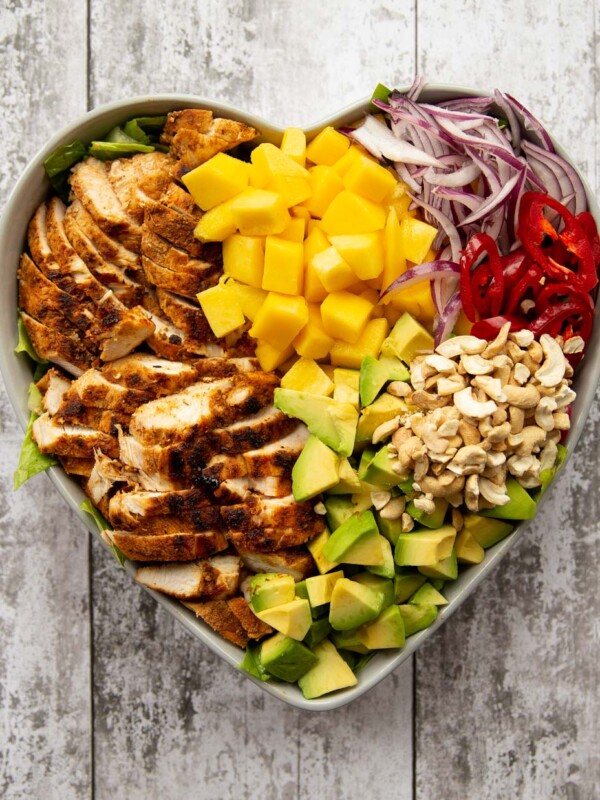 overhead shot of salad served in a heart shaped bowl