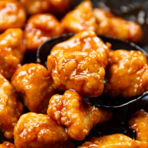 closeup shot of chicken in pan resting in ladle