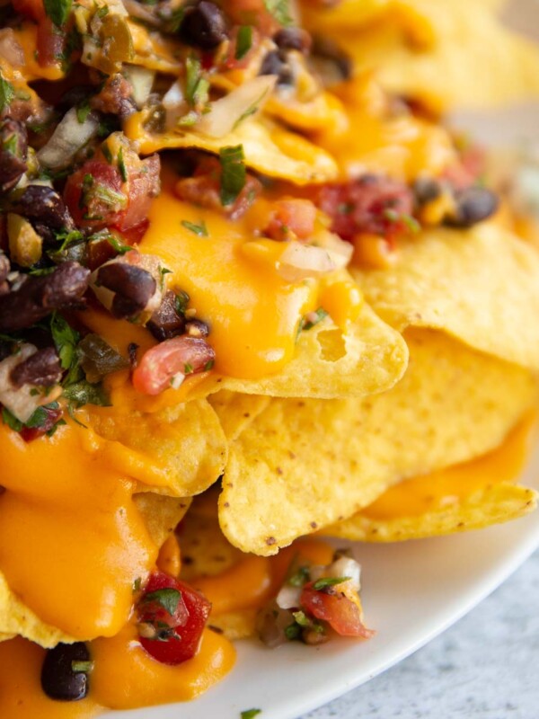 close up shot of cheese drippings of tortilla chip