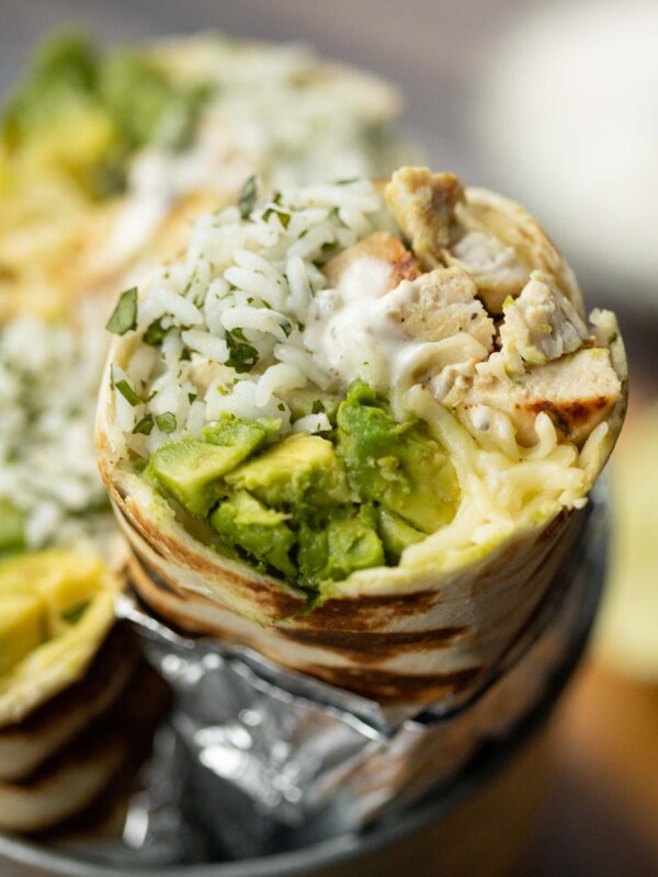 closeup shot of burrito sliced open showing filling