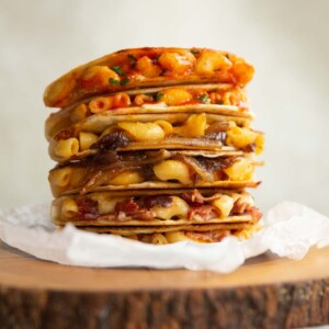 6 quesadillas stacked on each other on wooden block