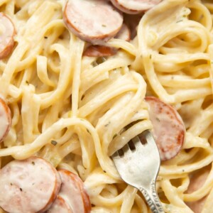 overhead shot of silver fork twizzling through pasta