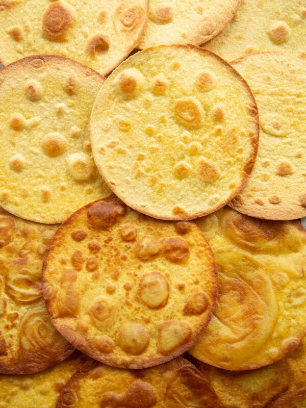 overhead shot of tostada shells overlapped on wire rack