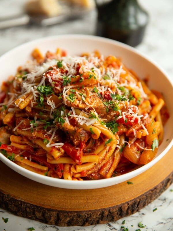 pasta served in large white bowl on wooden board