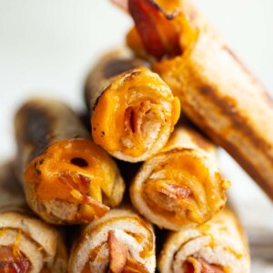 close up shot of roll ups stacked on each other on parchment paper