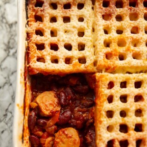 overhead shot of waffle cowboy pie with one waffle missing showing filling