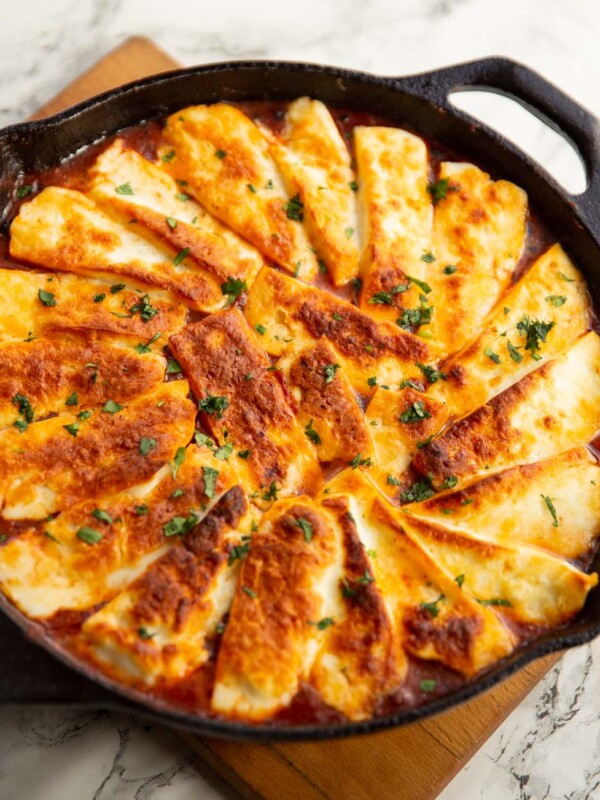 halloumi hotpot fresh out the oven on wooden chopping board