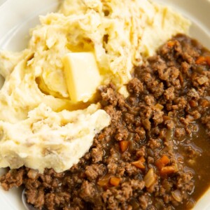 mince and tatties served in large white bowl with silver spoon