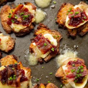 brie bacon cranberry smashed potatoes on baking tray fresh out the oven