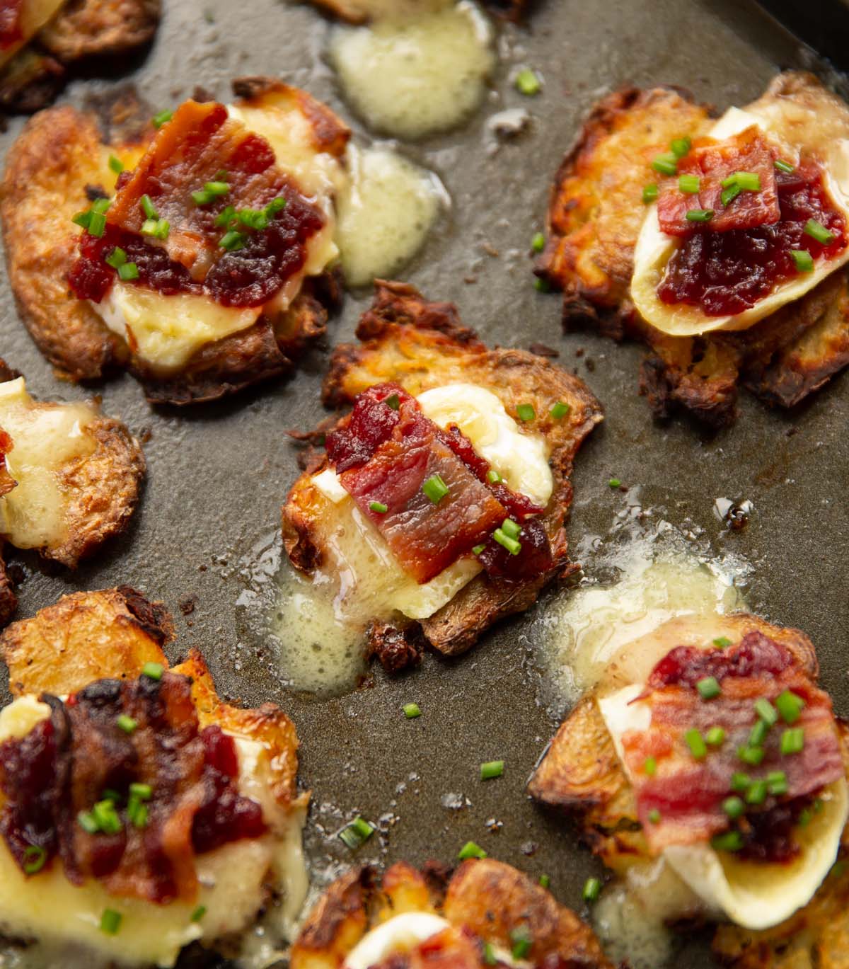 https://www.dontgobaconmyheart.co.uk/wp-content/uploads/2023/11/brie-bacon-cranberry-smashed-potatoes.jpg