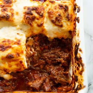 close up shot of ravioli beef ragu bake showing filling