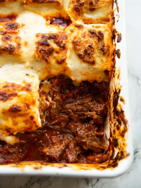 close up shot of ravioli beef ragu bake showing filling