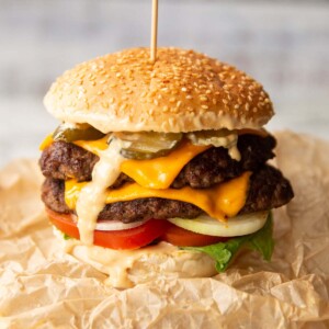 double smash burger on brown scrunched up parchment paper