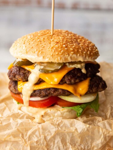 double smash burger on brown scrunched up parchment paper