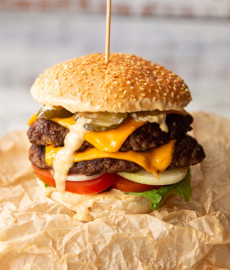 double smash burger on brown scrunched up parchment paper