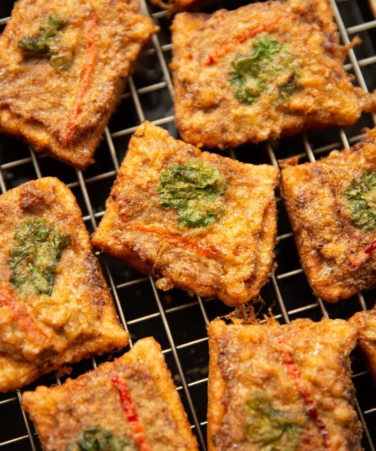 close up overhead shot of thai pork toast on wire rack