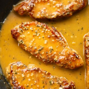 3 garlic rosemary butter pork chops in large pan