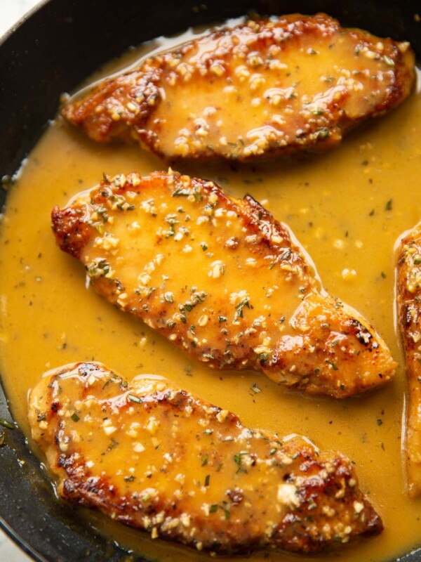 3 garlic rosemary butter pork chops in large pan