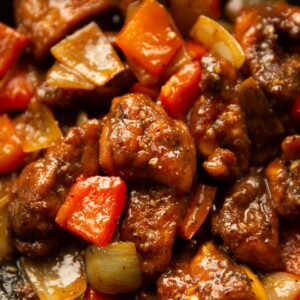 close up shot of black pepper chicken in pan