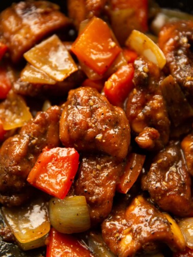 close up shot of black pepper chicken in pan