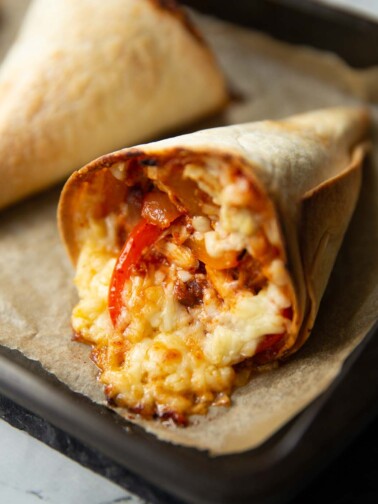 close up shot of quesadilla cone fresh out the oven on baking tray