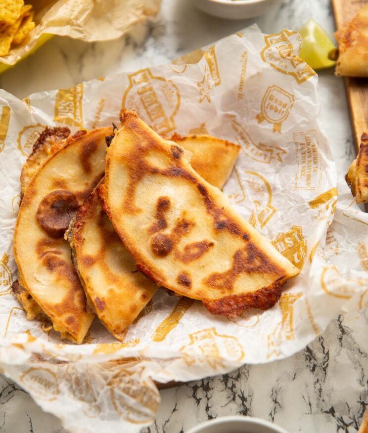 overhead shot of chicken jalapeno popper tacos on serving wrapper