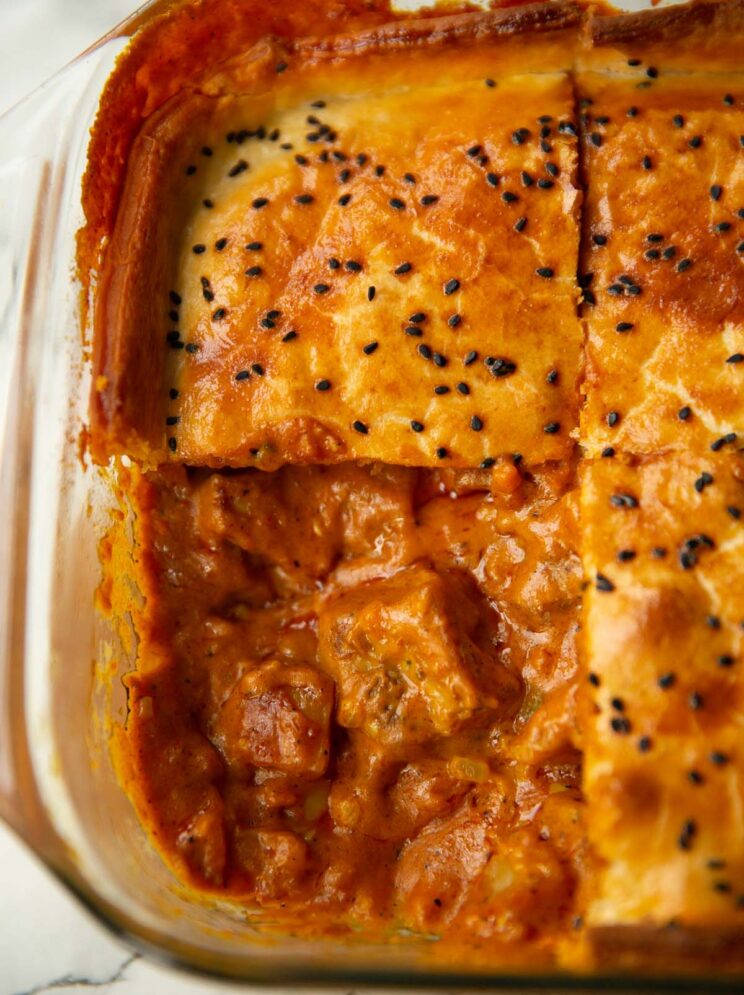 close up shot of curried chicken pie with portion taken out