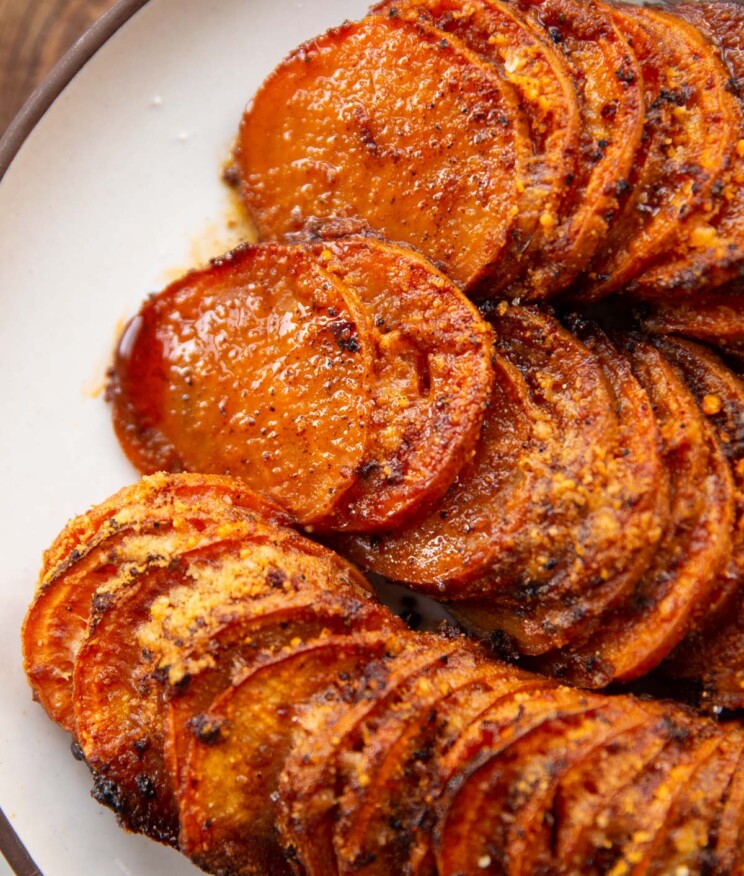 close up shot of cajun butter sweet potato bake on white plate