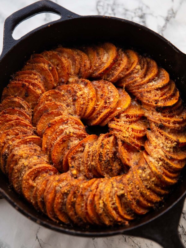 cajun butter sweet potato spiral in cast-iron pan fresh out the oven