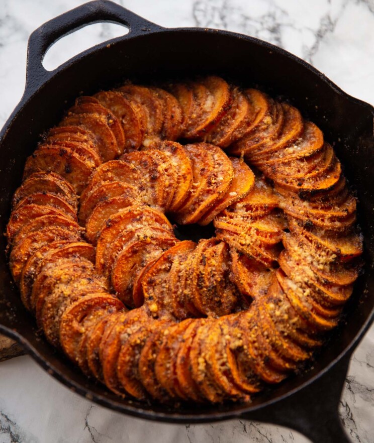 cajun butter sweet potato spiral in cast-iron pan fresh out the oven