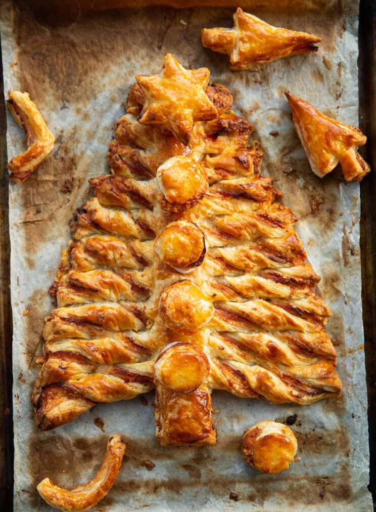 overhead shot of ham cheese puff pastry Christmas tree on baking tray fresh out the oven