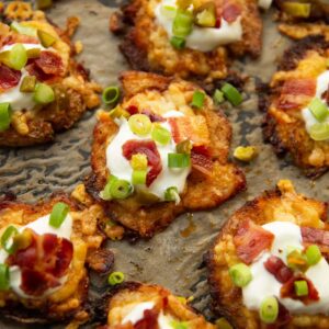 loaded smash potatoes on baking tray