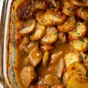 close up shot of sausage hotpot with portion missing showing filling