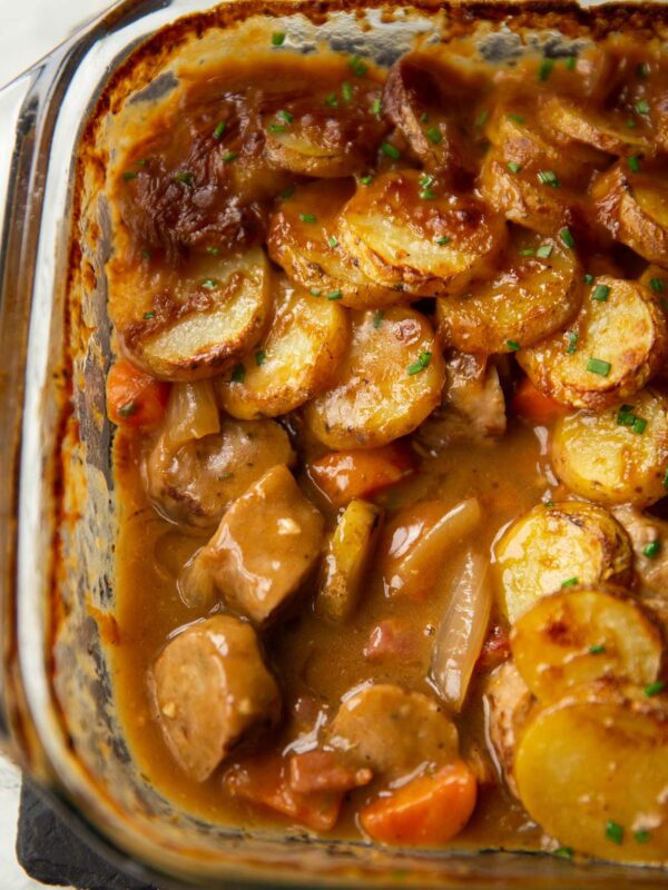 close up shot of sausage hotpot with portion missing showing filling